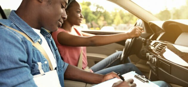 Girl taking a behind the wheel drivers training course